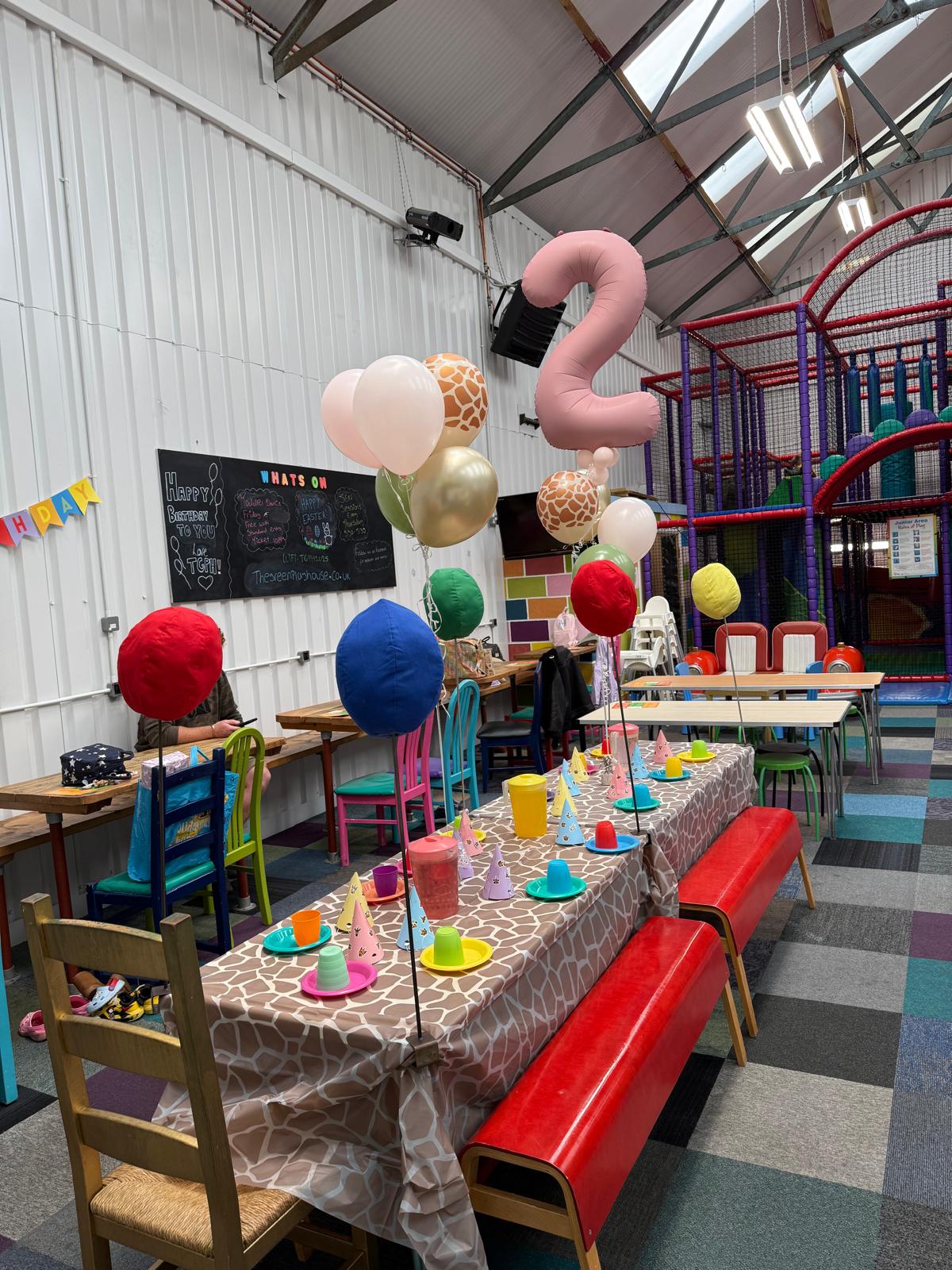 Colourful birthday party table setup at The Green Playhouse